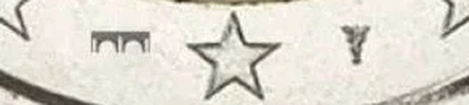 €C# 406.2 币面下方两侧印记